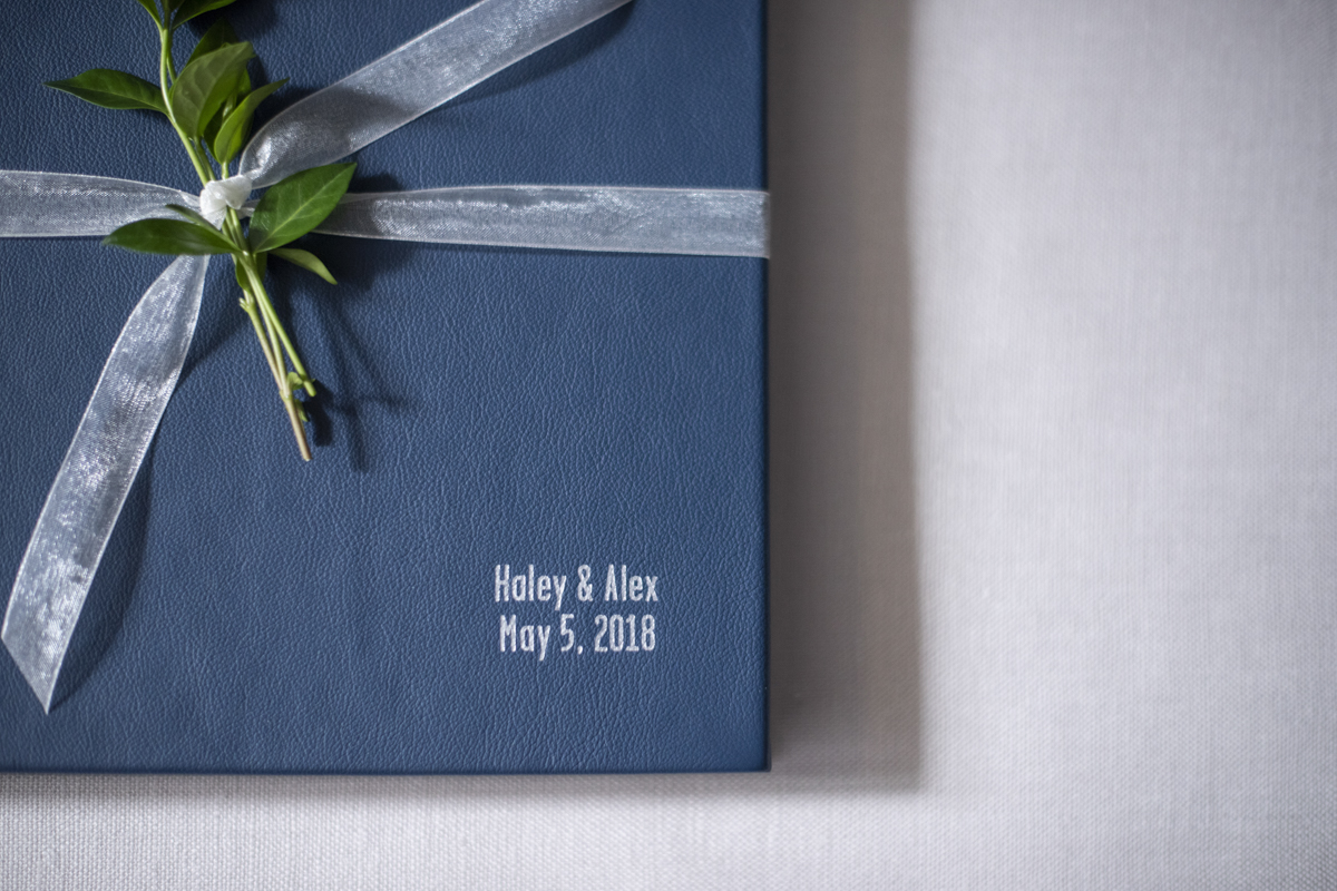 Navy blue leather wedding album with silver foil deboss by Jessica Merithew Photography