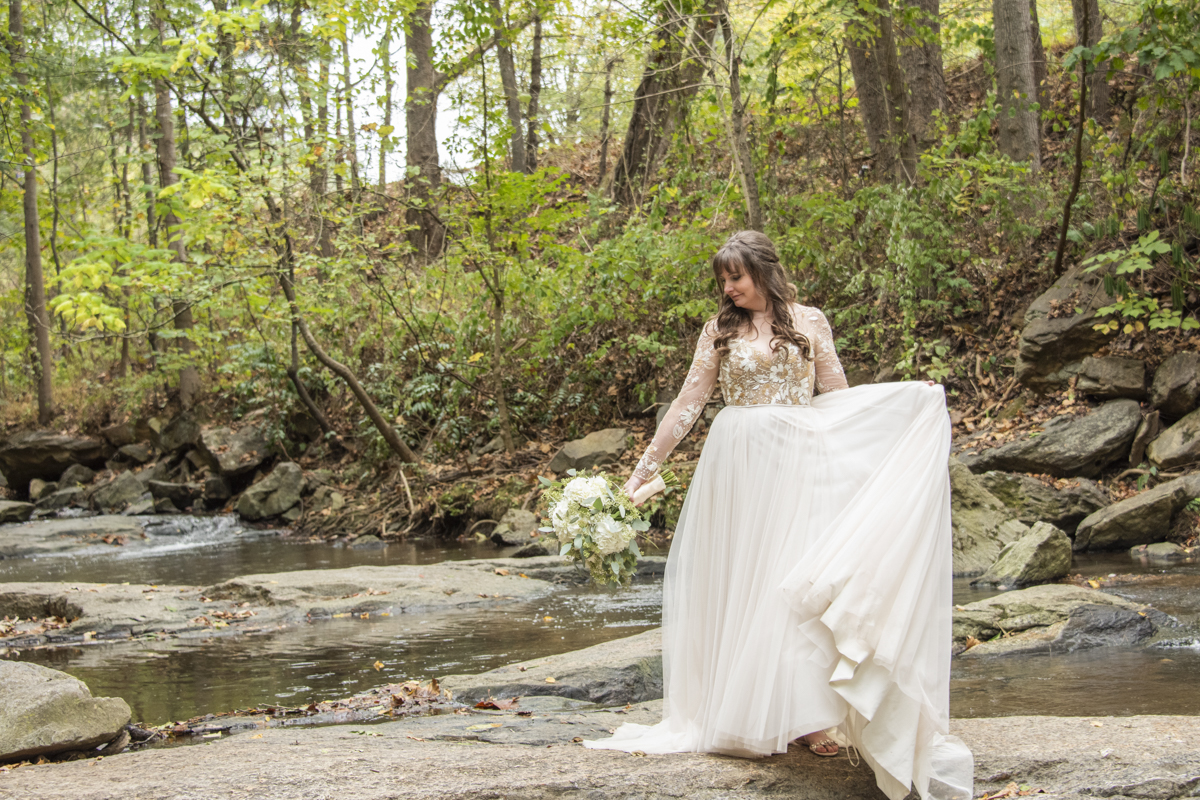 Bridal portrait with dress flowing and hydrangea bridal bouquet in Asheville wedding