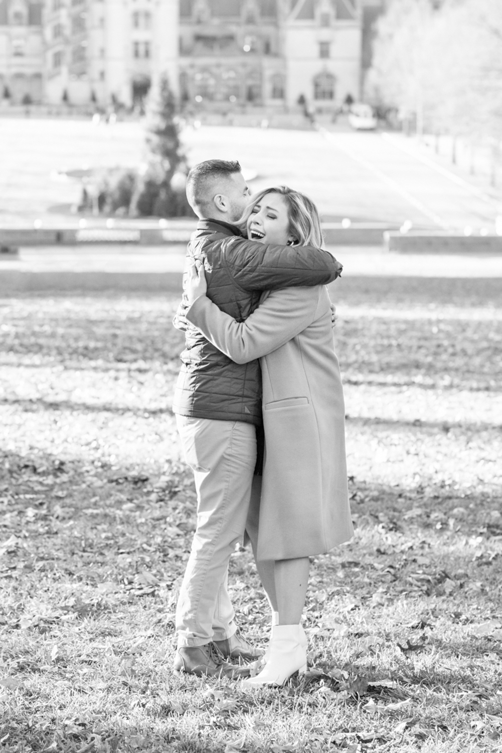 Couple hugging after proposal at Biltmore Estate in Asheville, NC