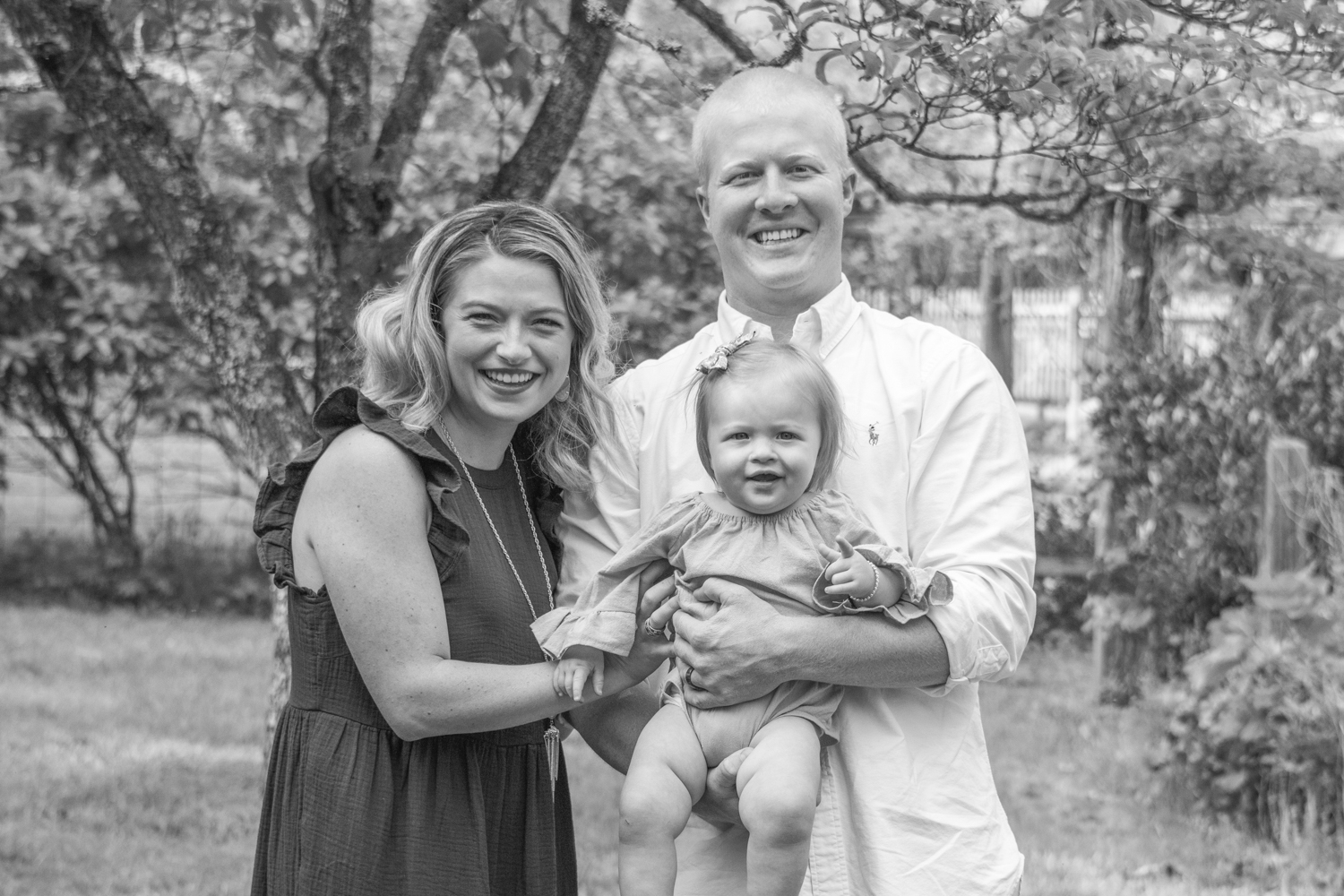 Family of three portrait on little girl's first birthday