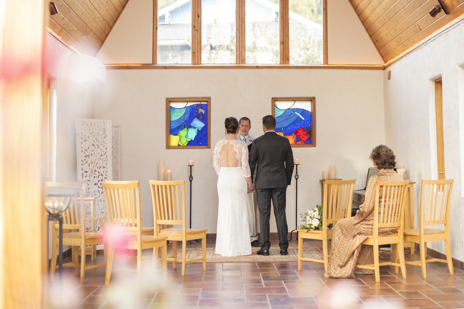 Couple holding hands at altar