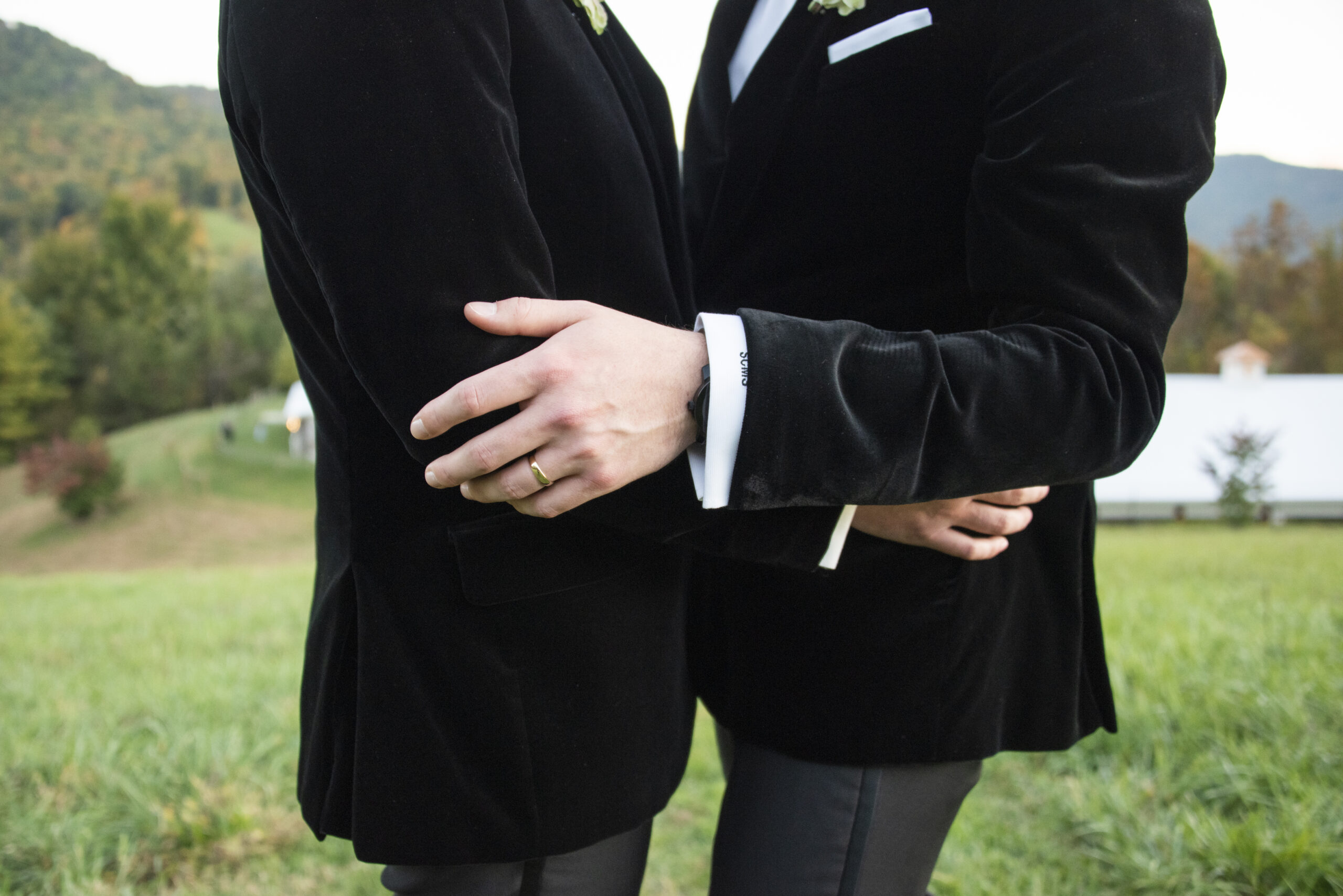 Couple holding onto each other at Chestnut Ridge Wedding Photography in Asheville, NC