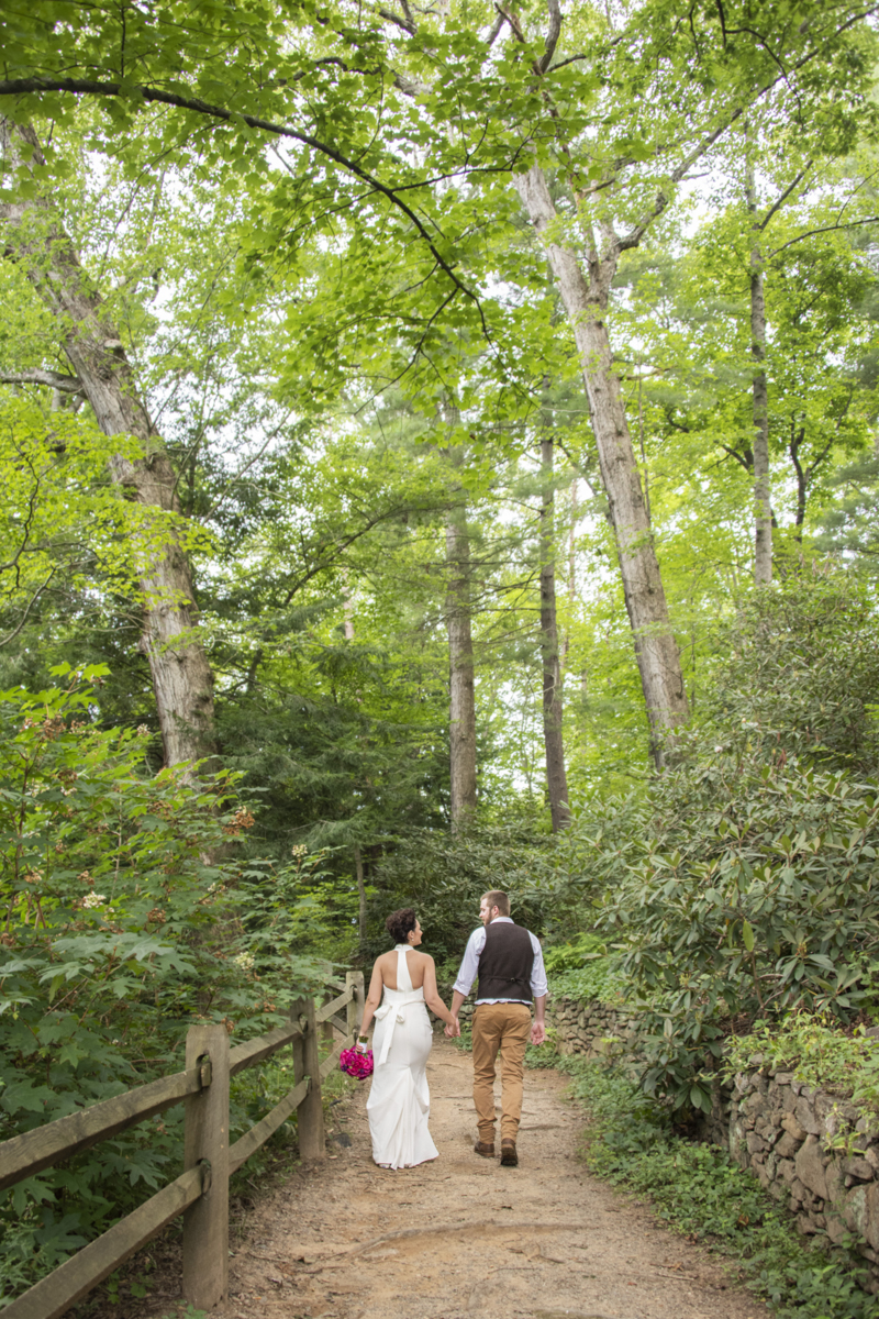 Couple walking away at Asheville Botanical Gardens elopement