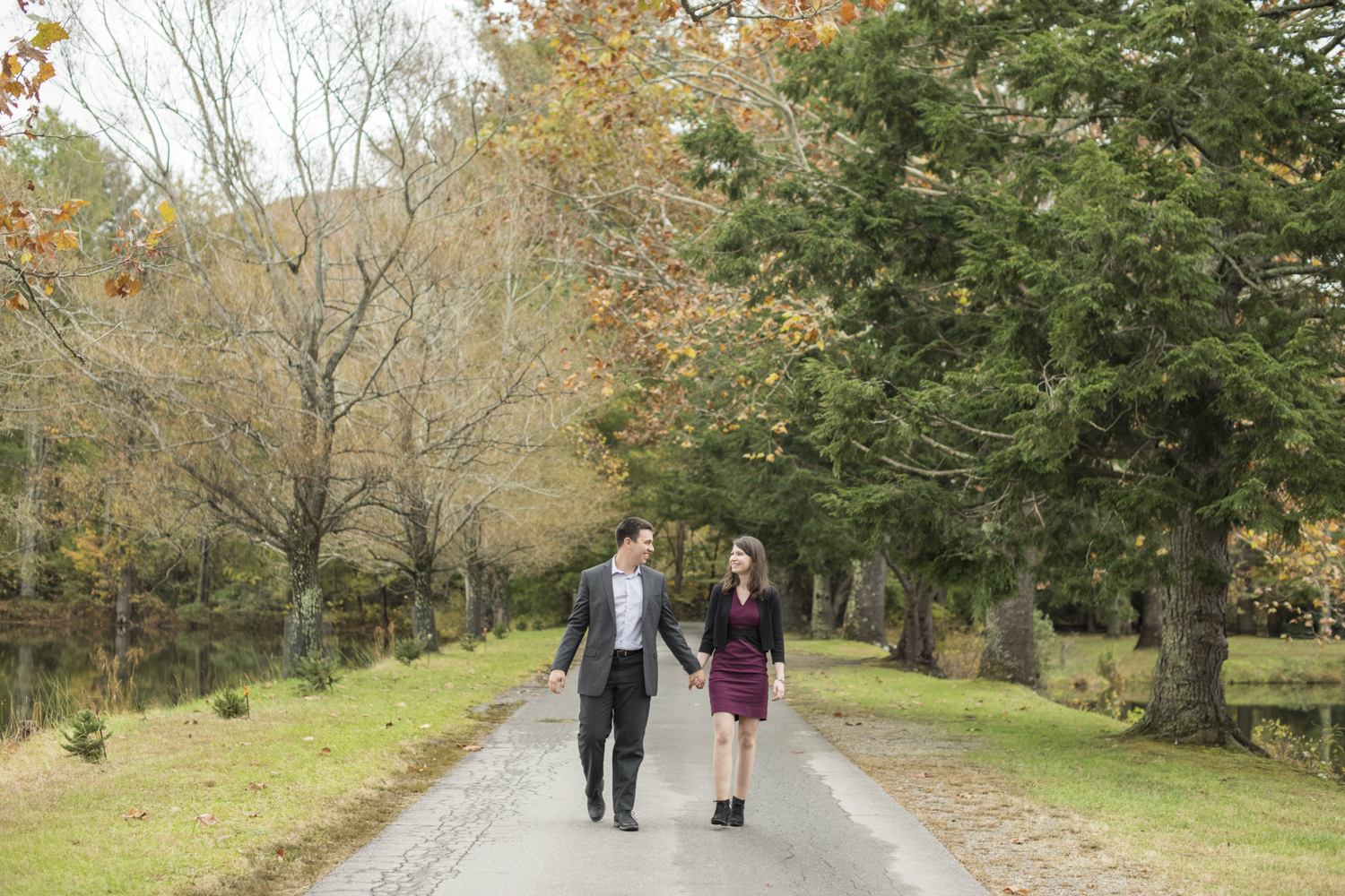 Couple walking at Lake Eden Events with Engagement Photo Locations in Asheville