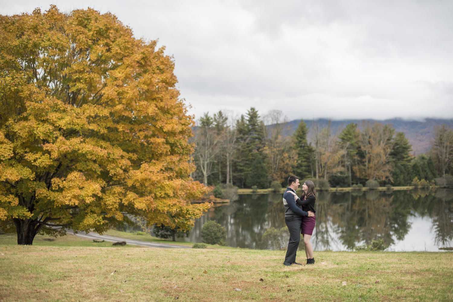 Couple looking at each other during fall at Engagement Photo Locations in Asheville