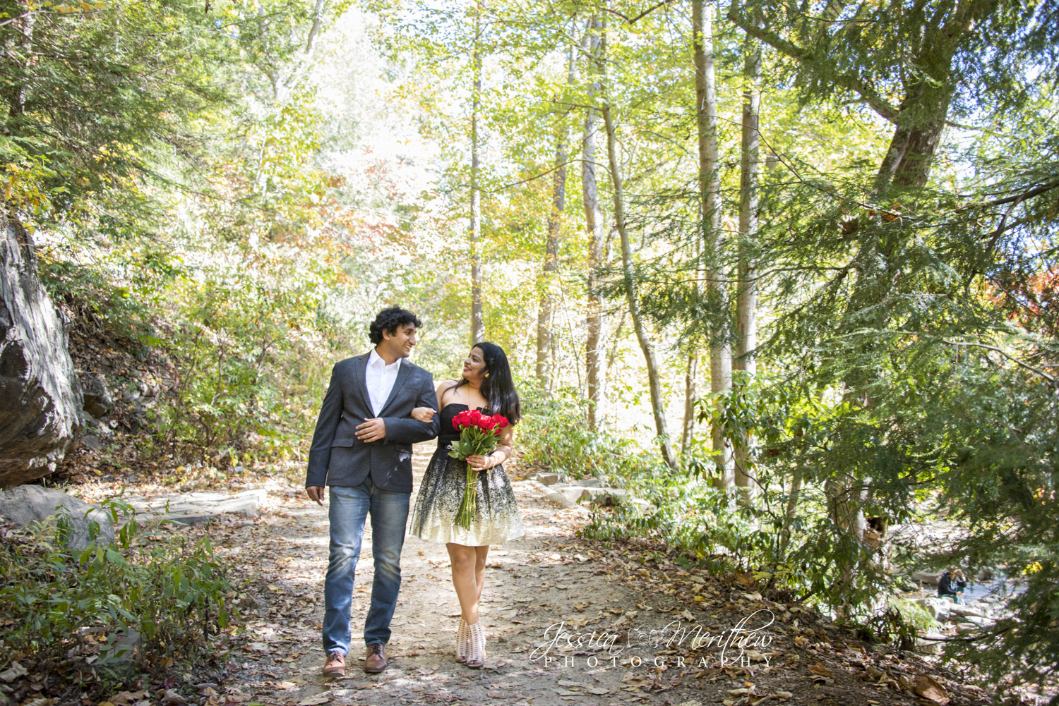 Couple walking together on path at Engagement Photo Locations in Asheville