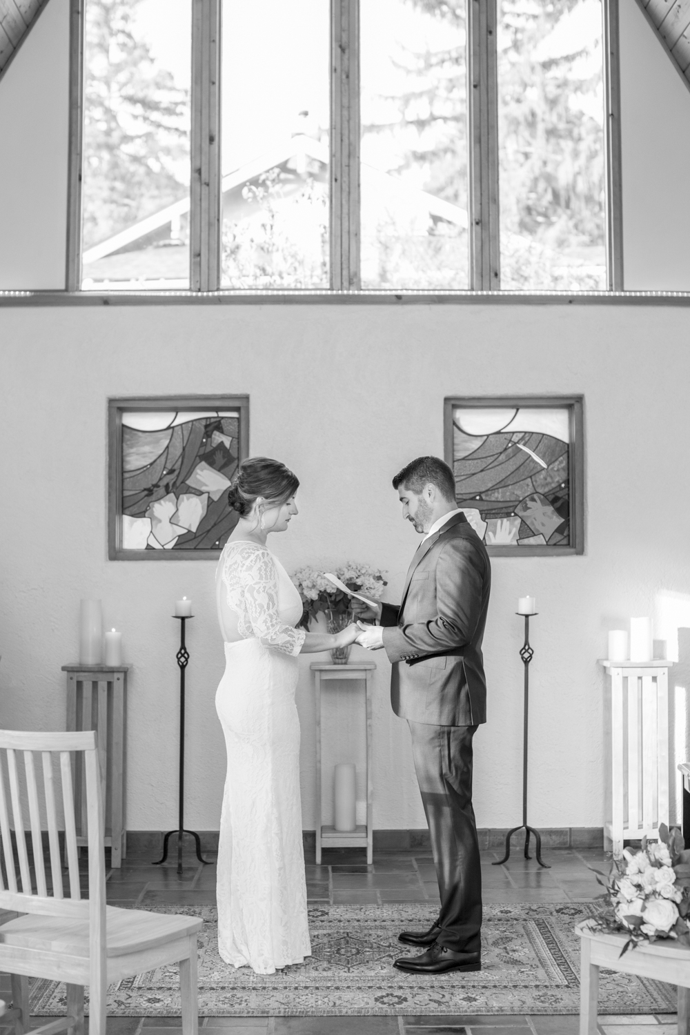 Couple reading vows at altar