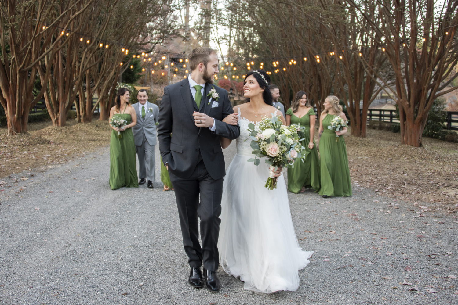 Couple walking with wedding party