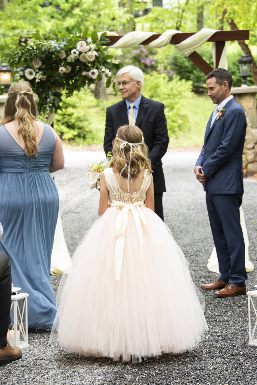 Flower girl walking down aisle