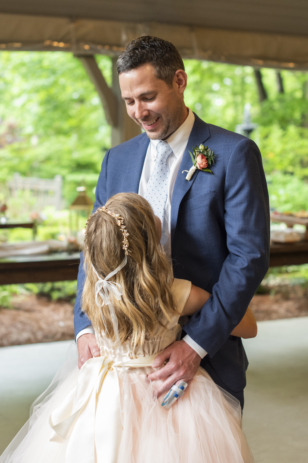 Groom and daughter dancing