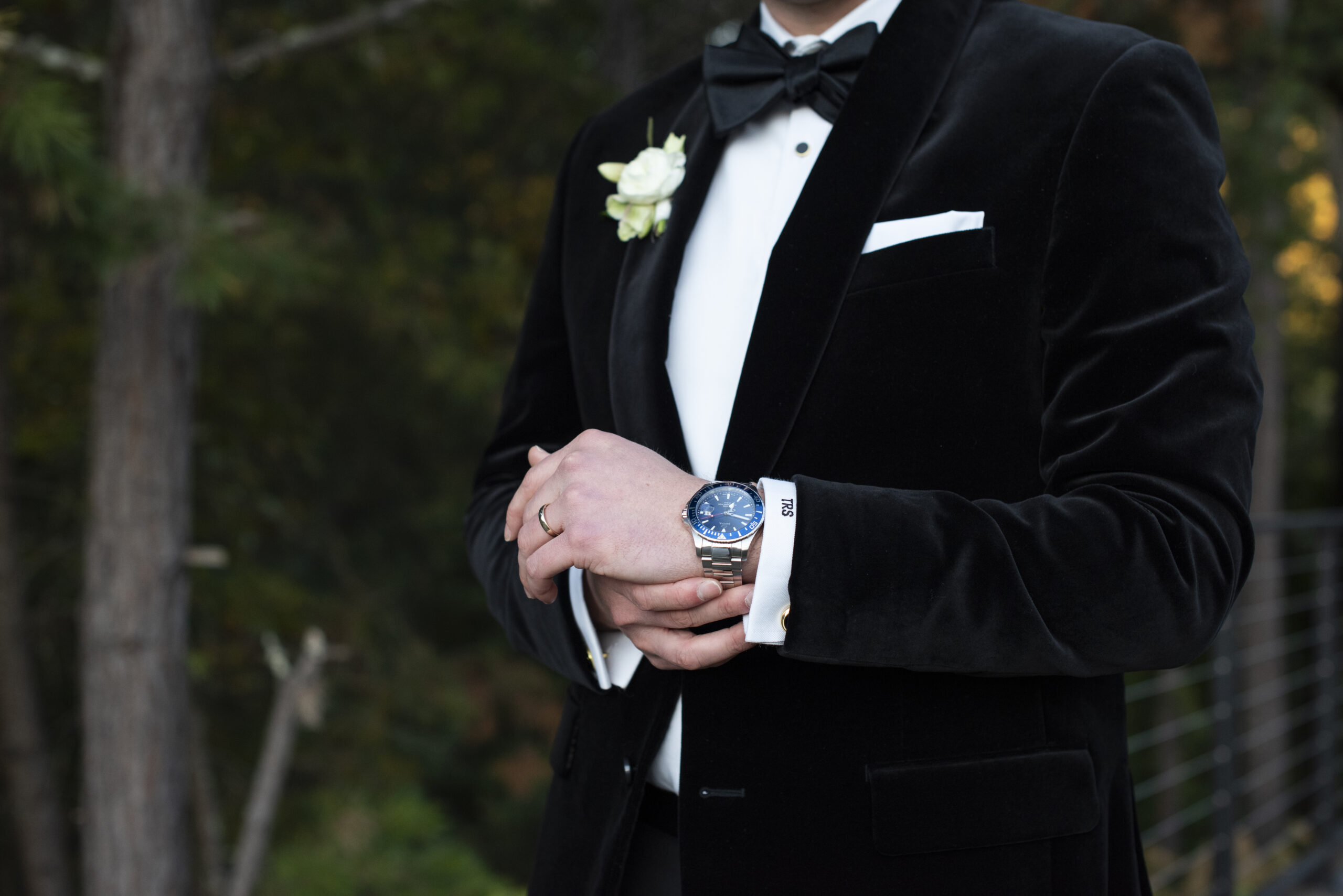 Groom adjusting watch at Chestnut Ridge Wedding Photography in Asheville, NC