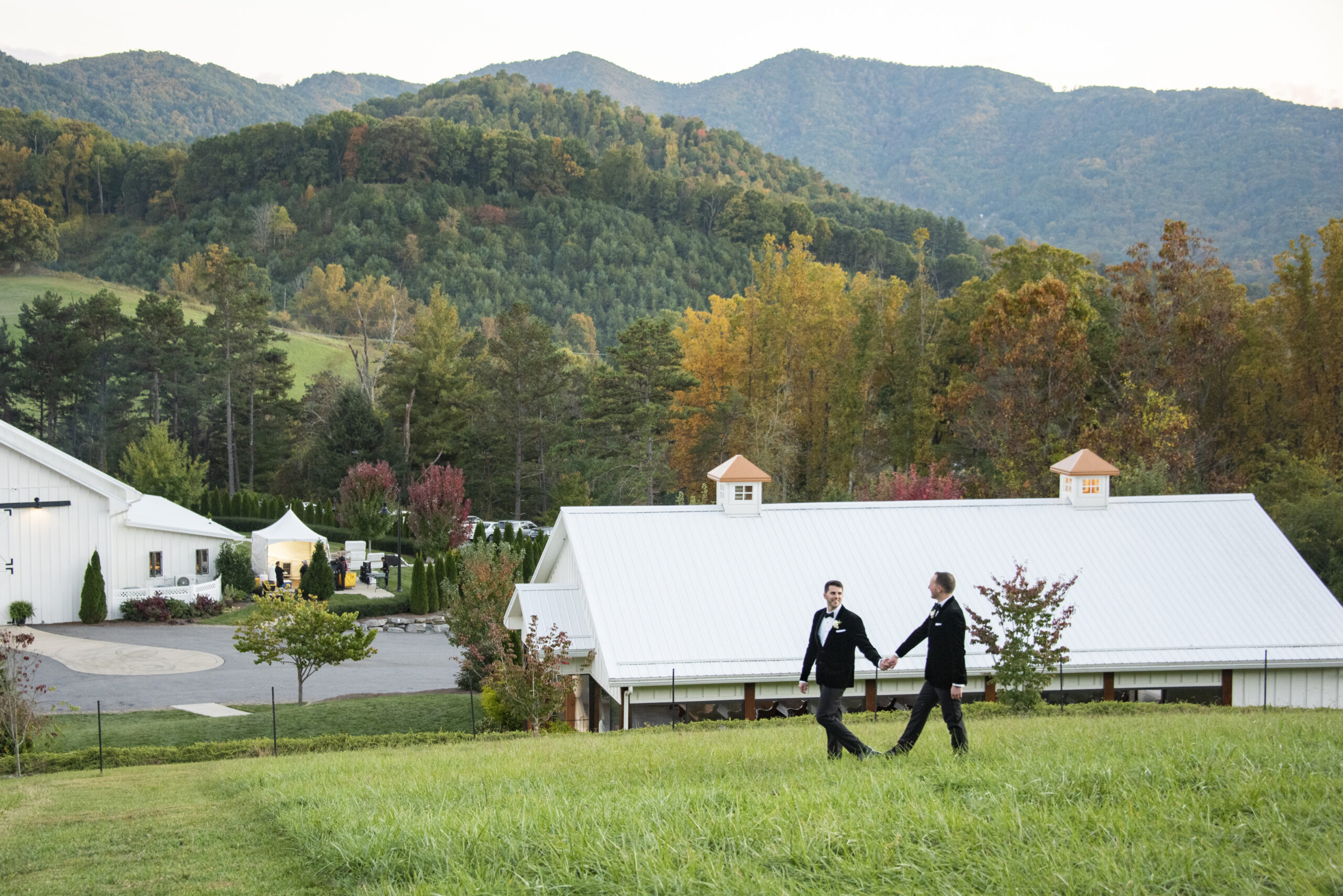 Couple walking with mountains in background at Chestnut Ridge Wedding Photography in Asheville, NC