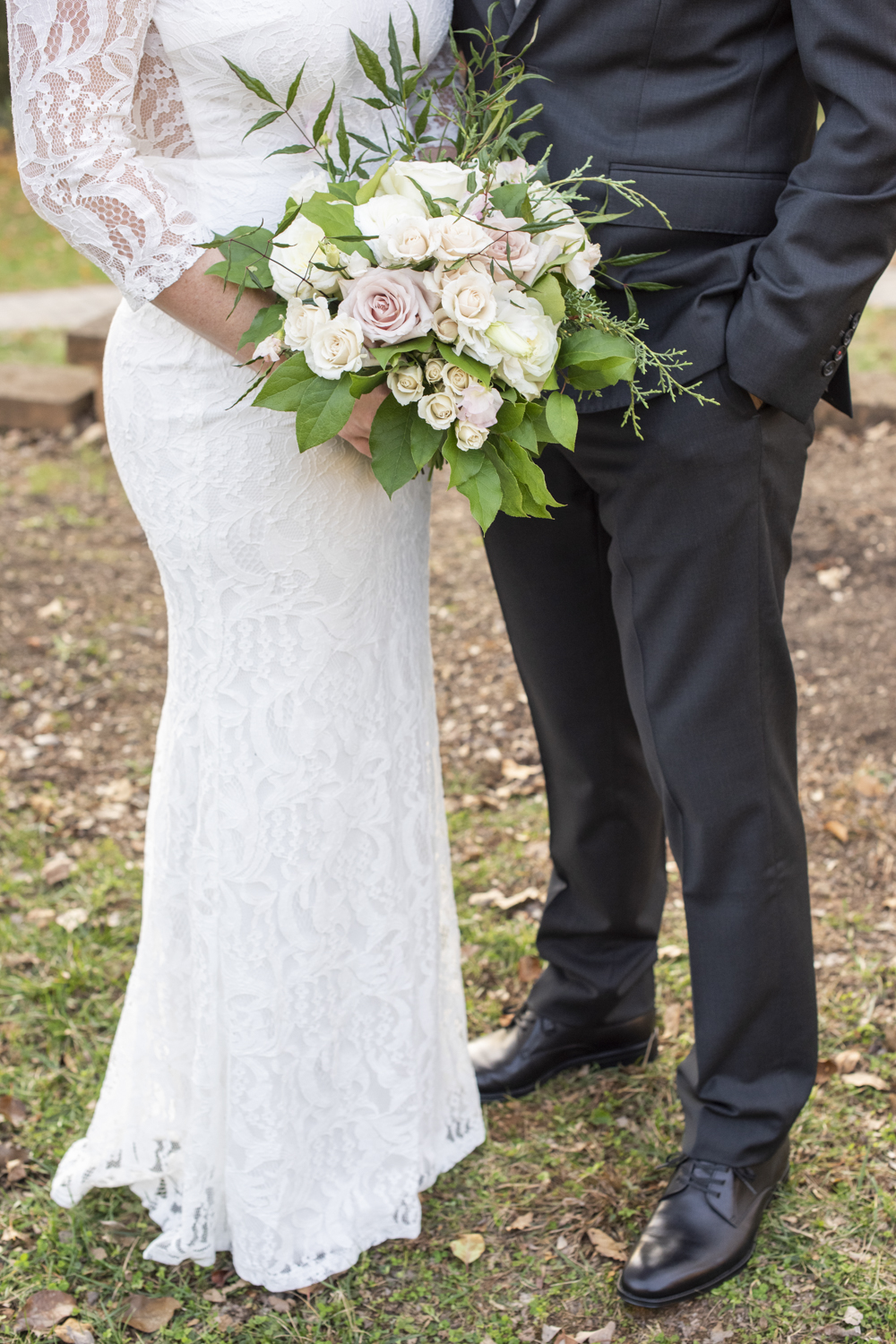 Couple's wedding attire and bouquet