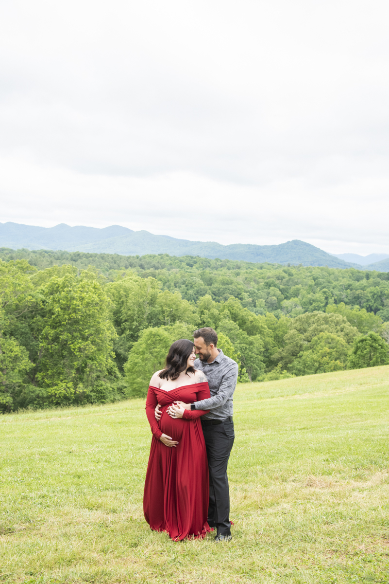 Asheville Maternity Photography with couple in front of mountain view