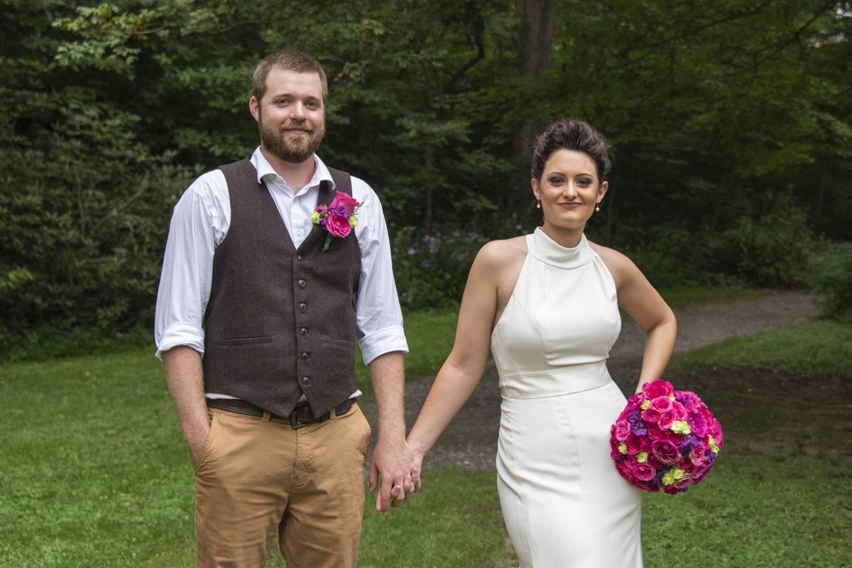 Couple holding hands at Asheville Botanical Gardens elopement