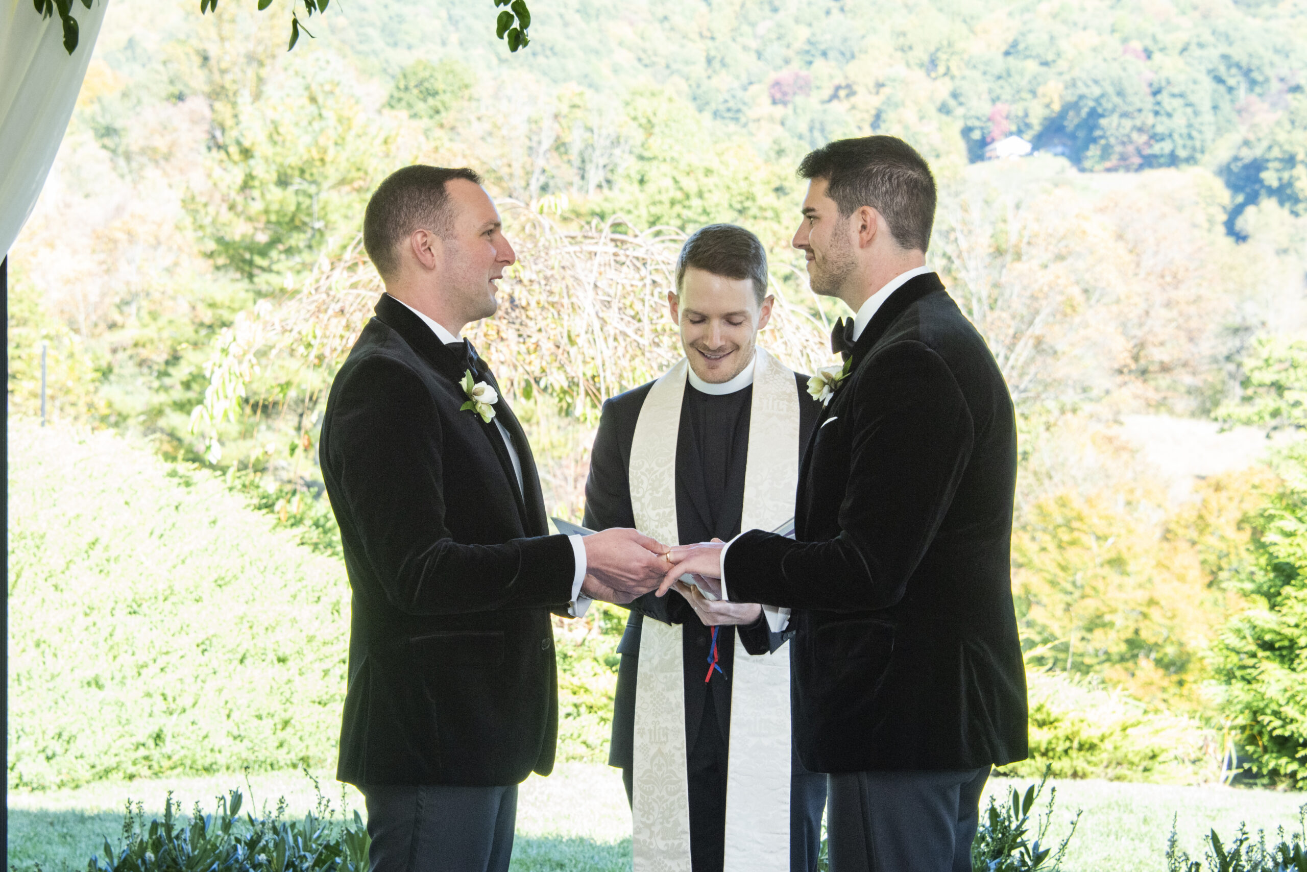 Couple exchanging rings at Chestnut Ridge Wedding Photography in Asheville, NC