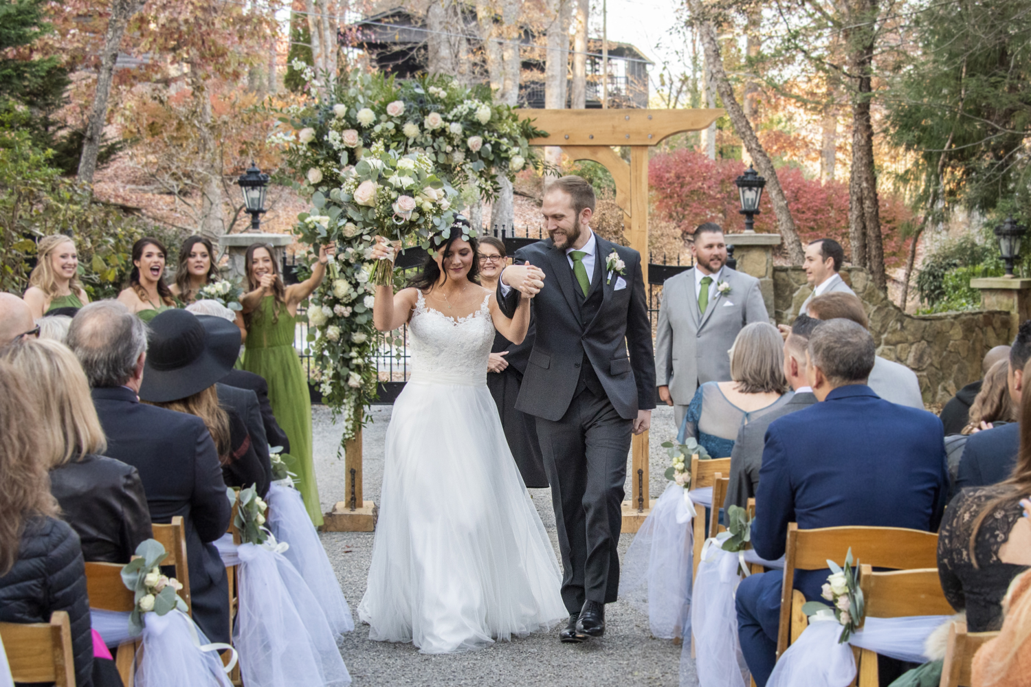 Couple walking down aisle at ceremony