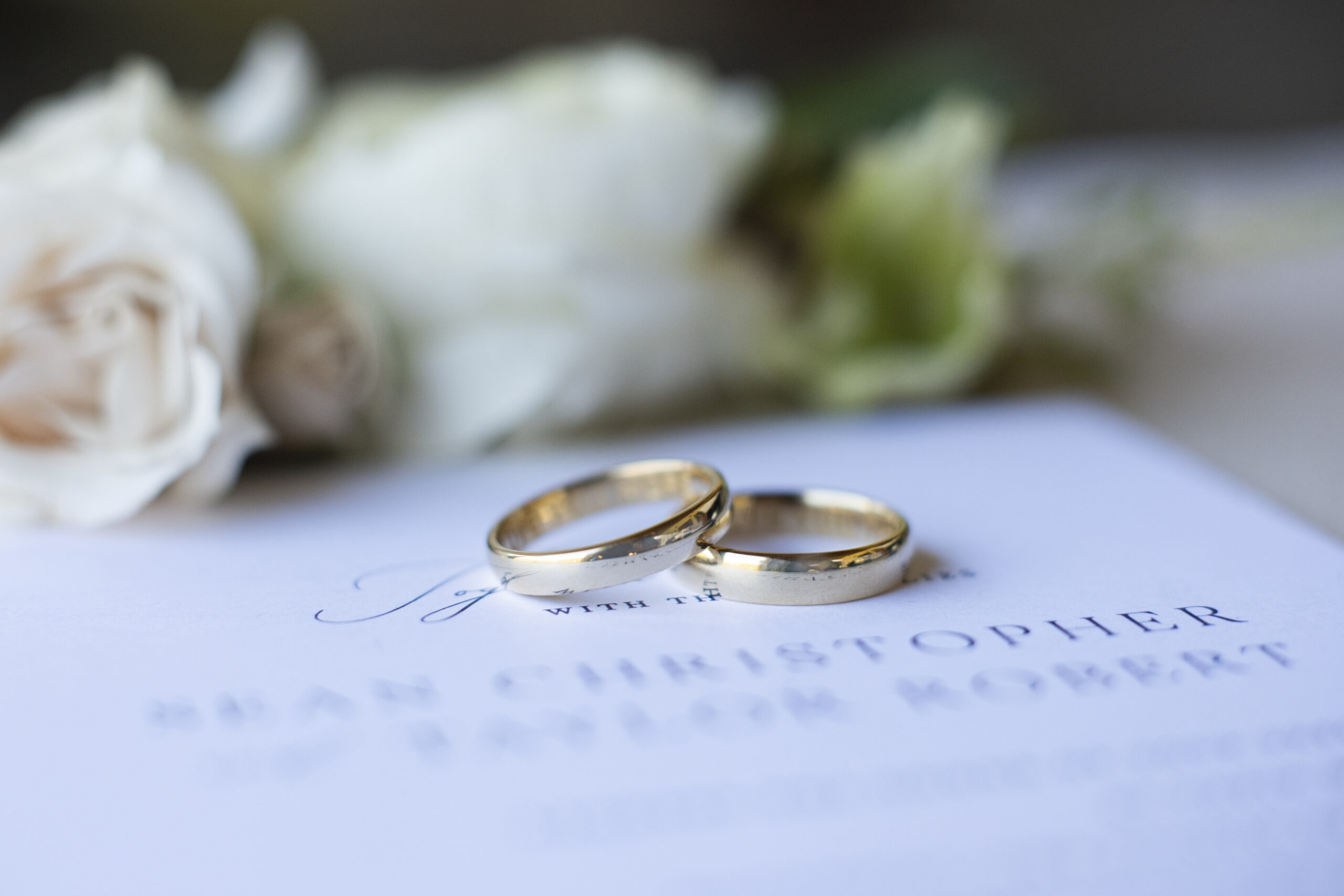 Wedding rings on invitation at Chestnut Ridge Wedding Photography in Asheville, NC