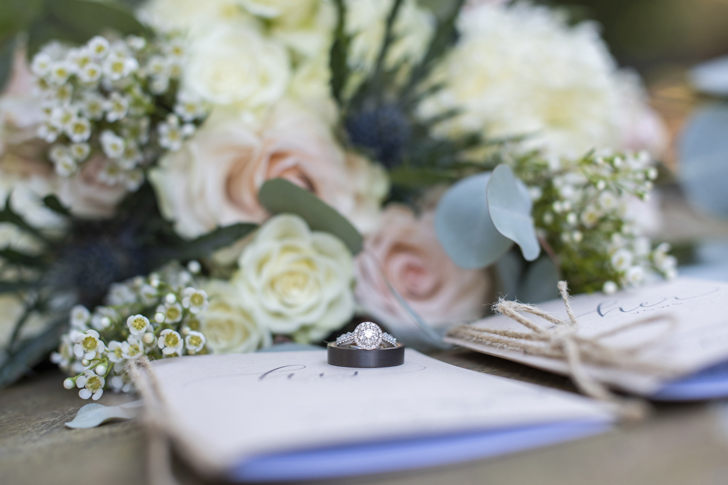 Wedding rings on vow books