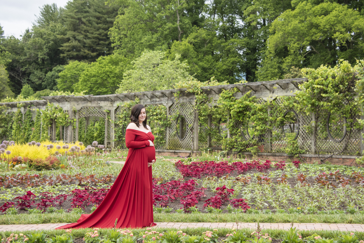 Asheville Maternity Photography at Biltmore Estate with woman in garden