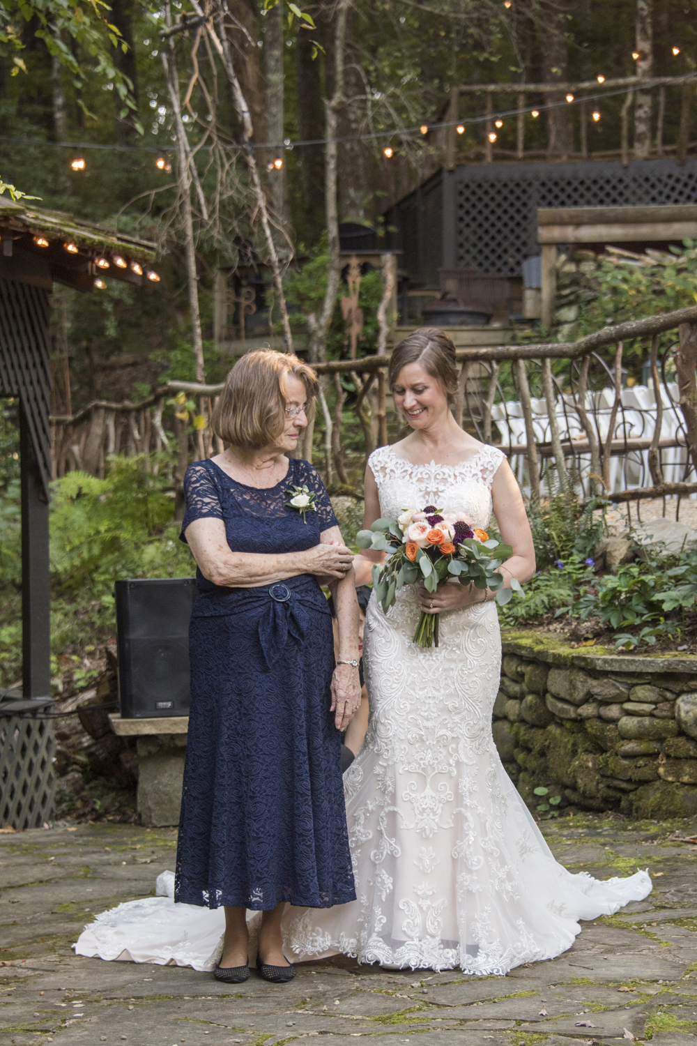 Bride and grandmother walking down aisle at Willow Falls Wedding Photography