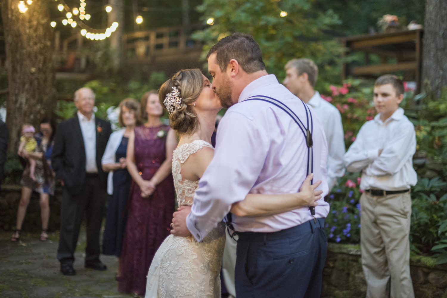 Couple kissing during first dance at Willow Falls Wedding Photography