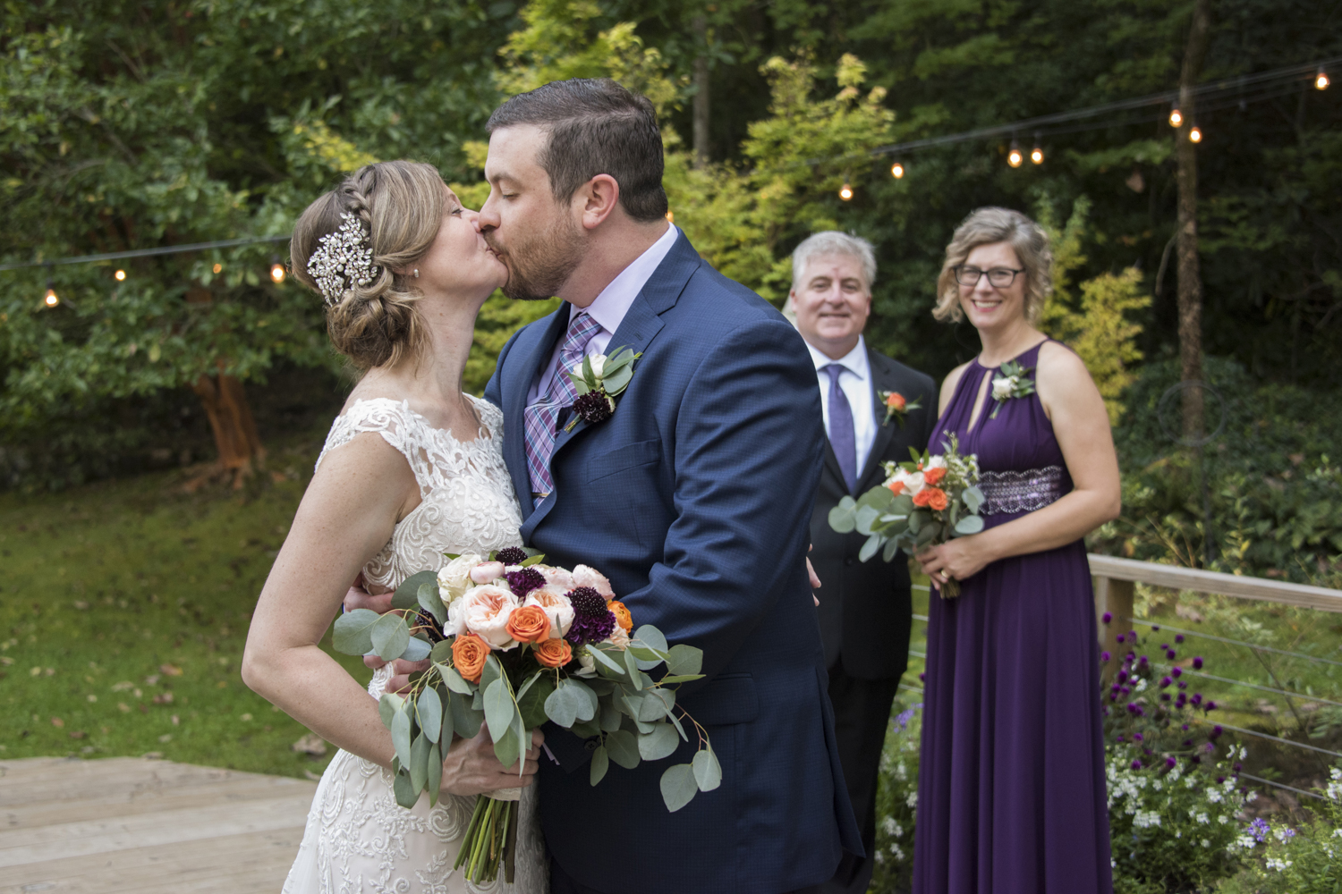 Couple with wedding party at Willow Falls Wedding Photography