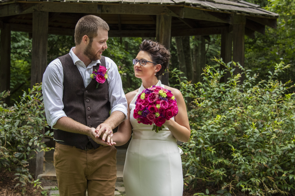 Couple walking together at Asheville Botanical Gardens elopement