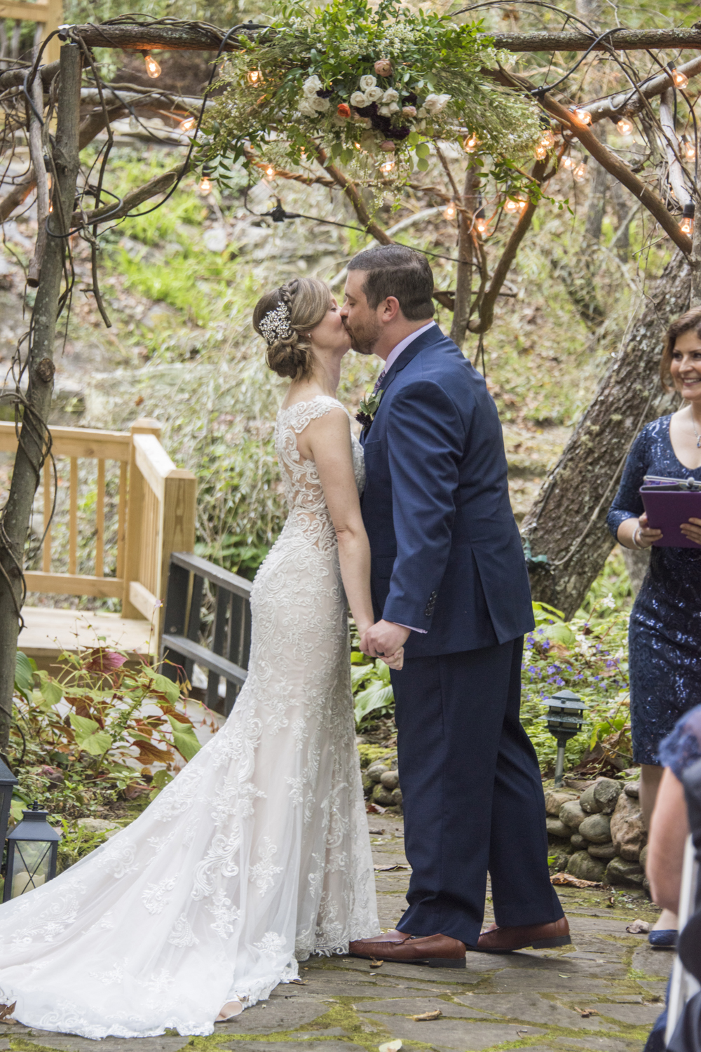 Couple's first kiss at Willow Falls Wedding Photography