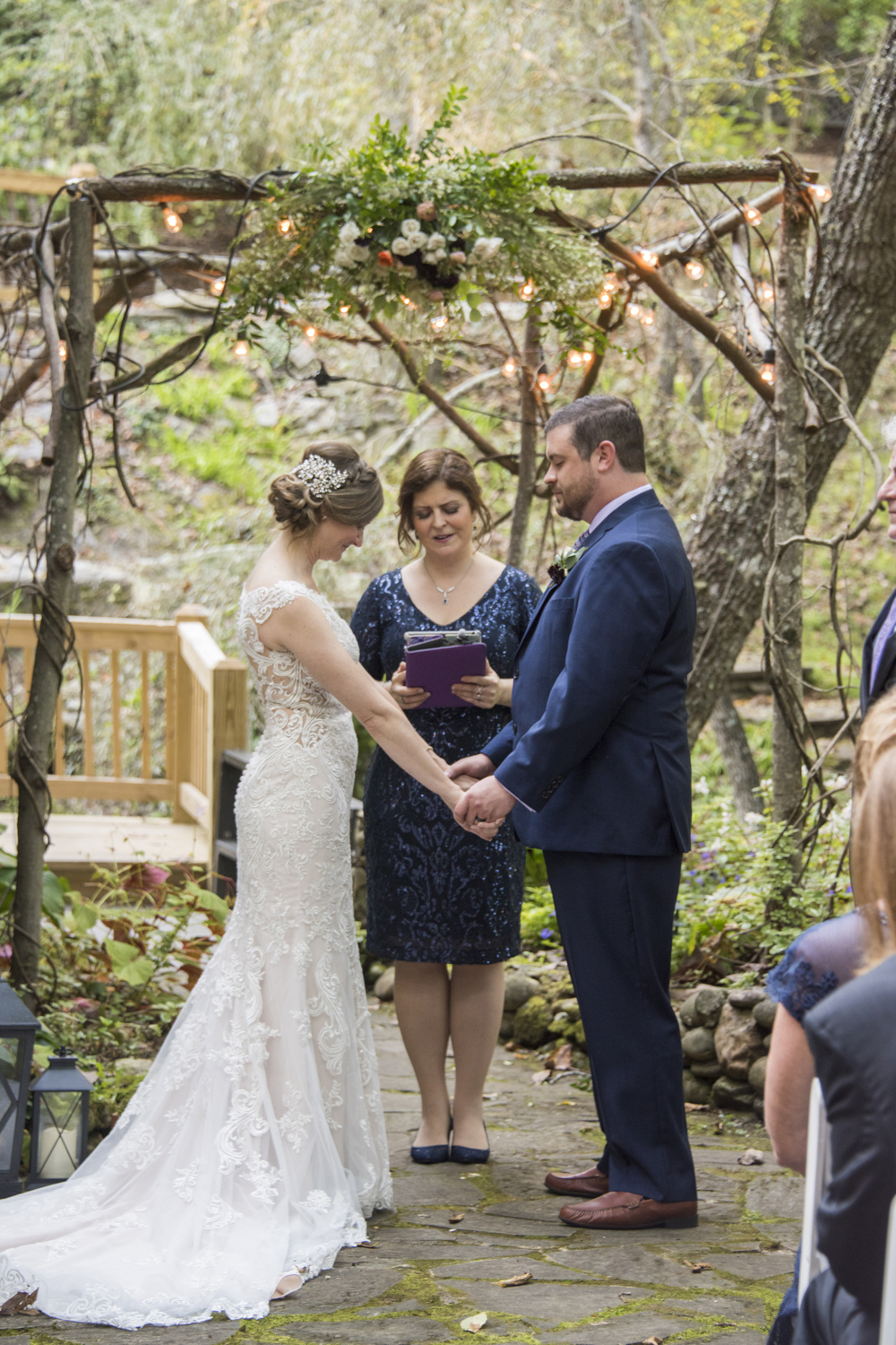 Couple praying during wedding ceremony