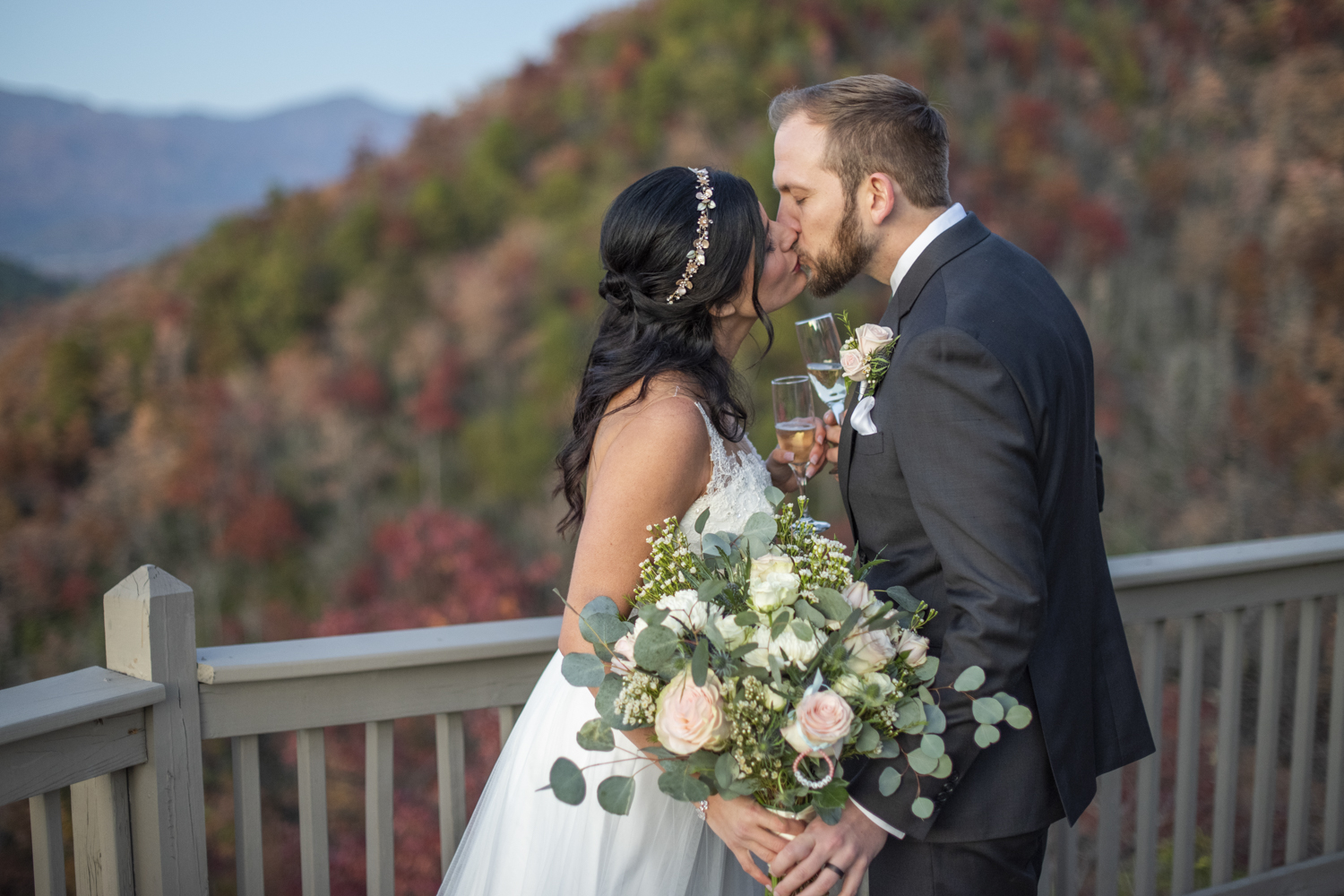 Couple kissing on mountain top at Hawkesdene Fall Wedding Photography