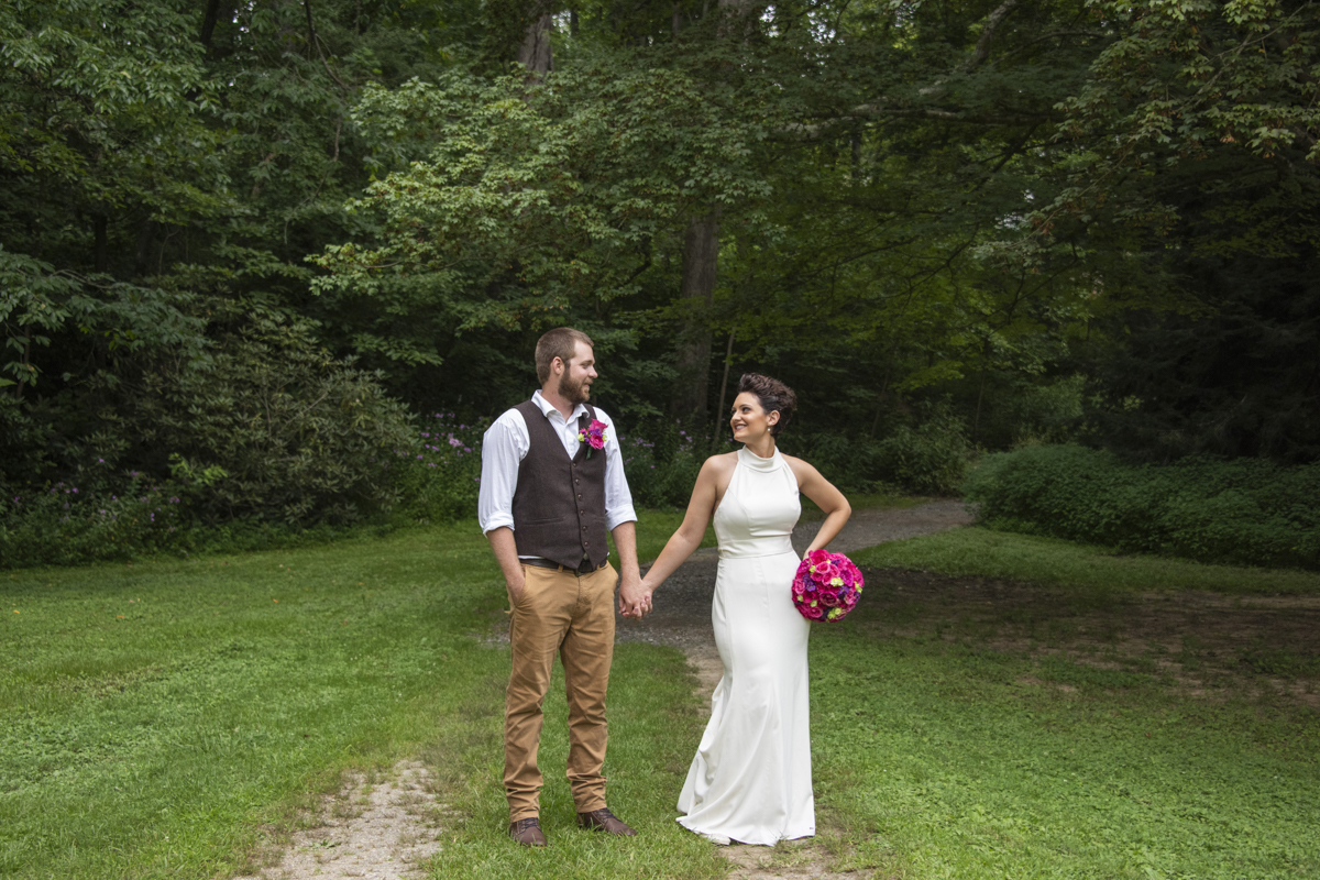 Couple holding hands at Asheville Botanical Gardens elopement
