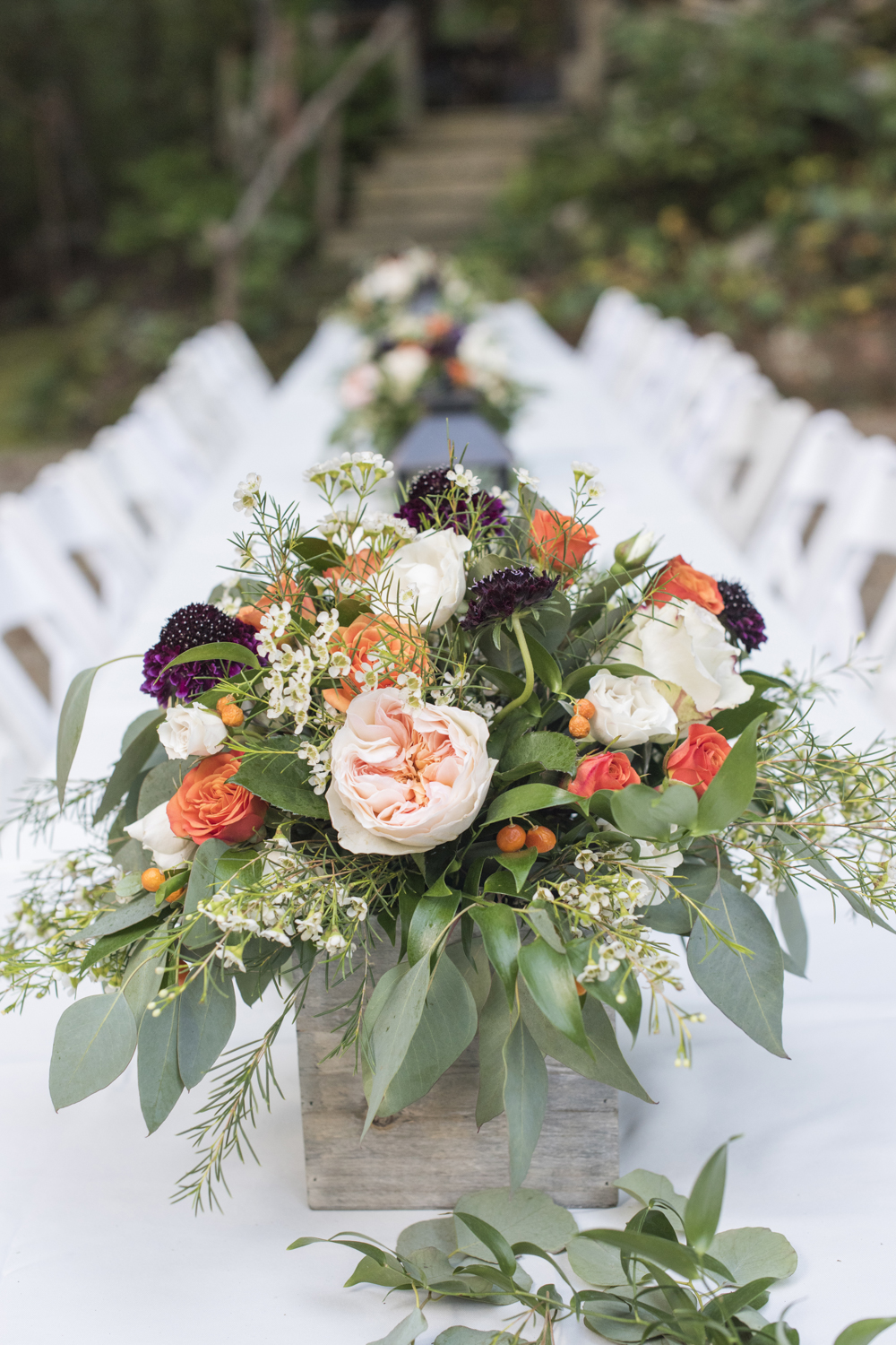 Colorful flower wedding centerpiece. in wood box