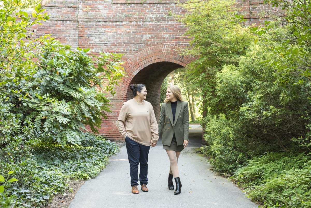 Couple walking after proposal with Asheville LGBTQ engagement photographer