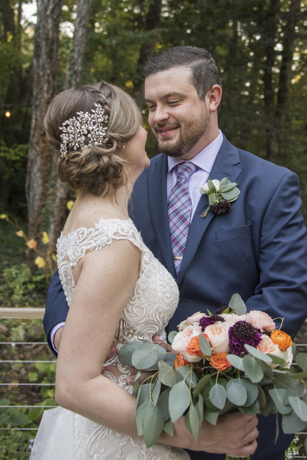 Groom smiling at bride