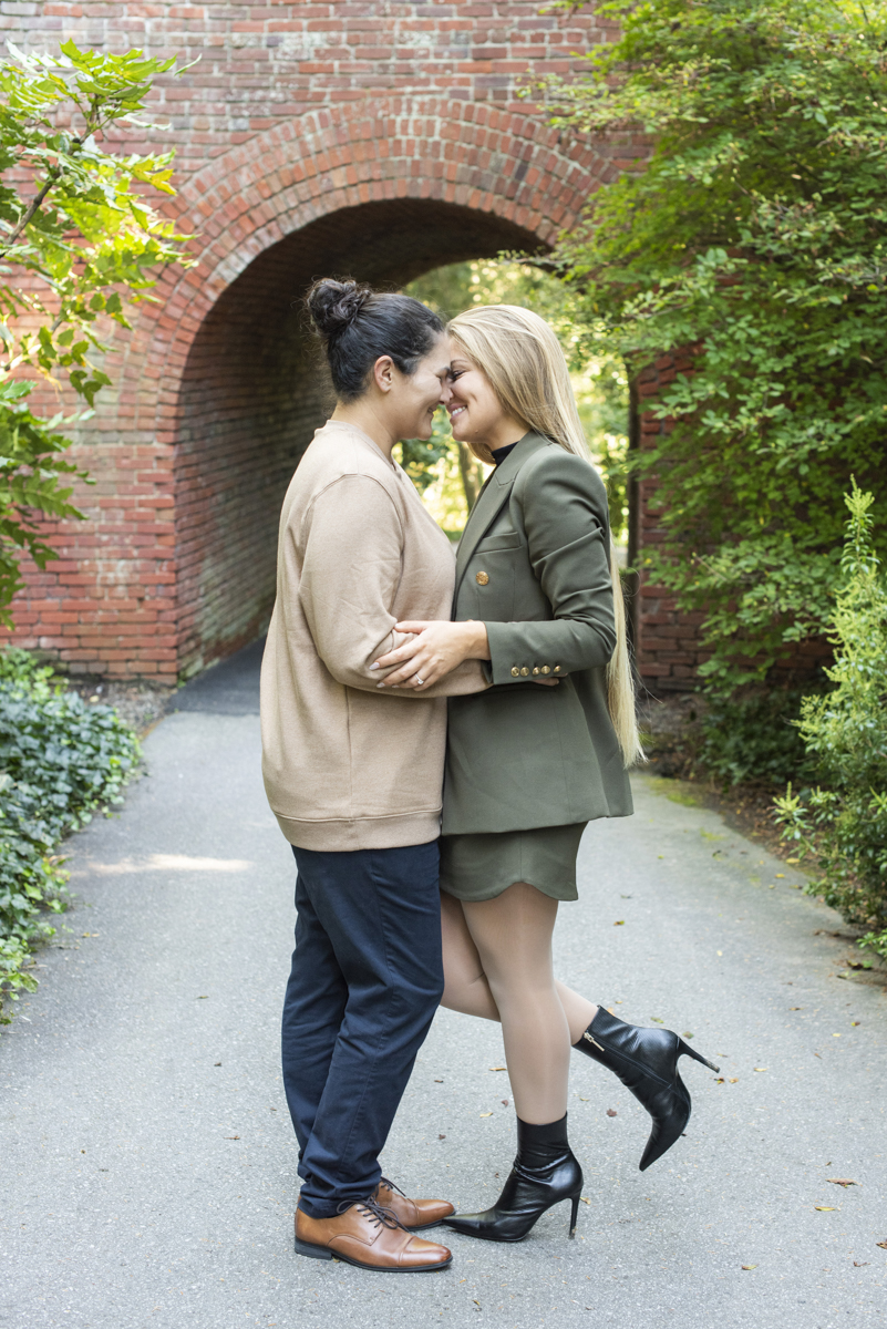 Couple almost kissing after proposal with Asheville LGBTQ engagement photographer