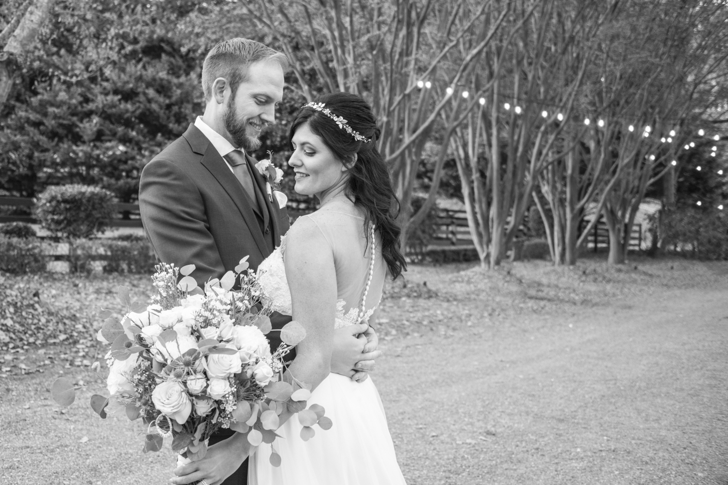 Couple looking at bouquet