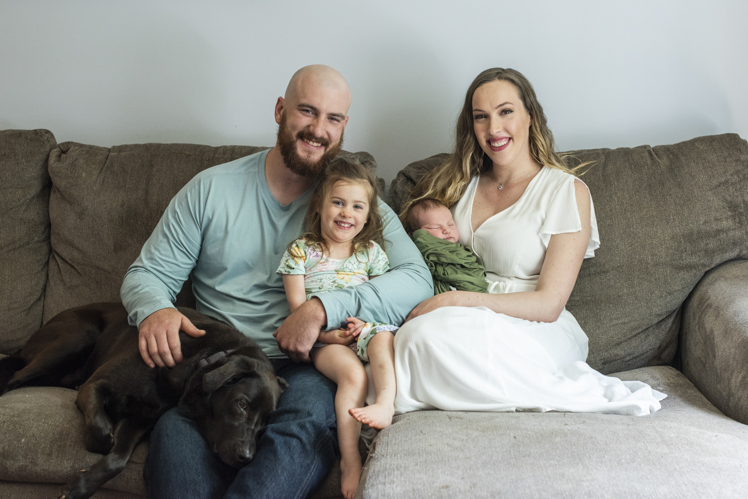 Family with dog and baby at home Newborn Photography in Asheville