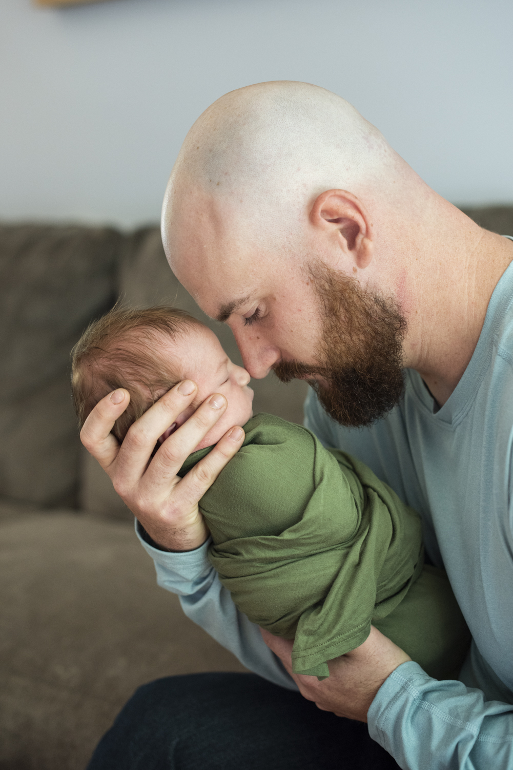 Dad and baby touching noses at home Newborn Photography in Asheville