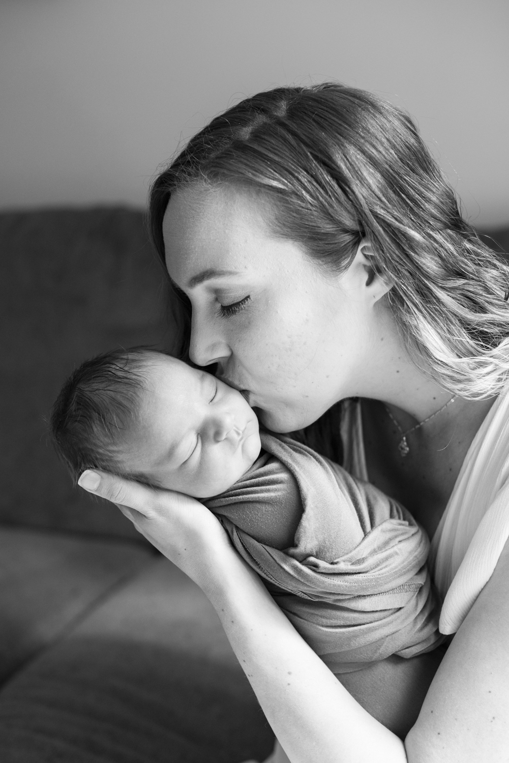 Mom kissing baby in Asheville, NC newborn