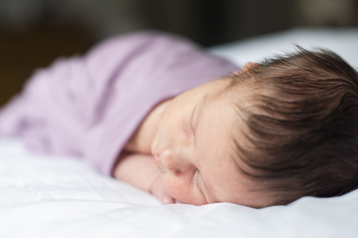 Newborn baby on belly