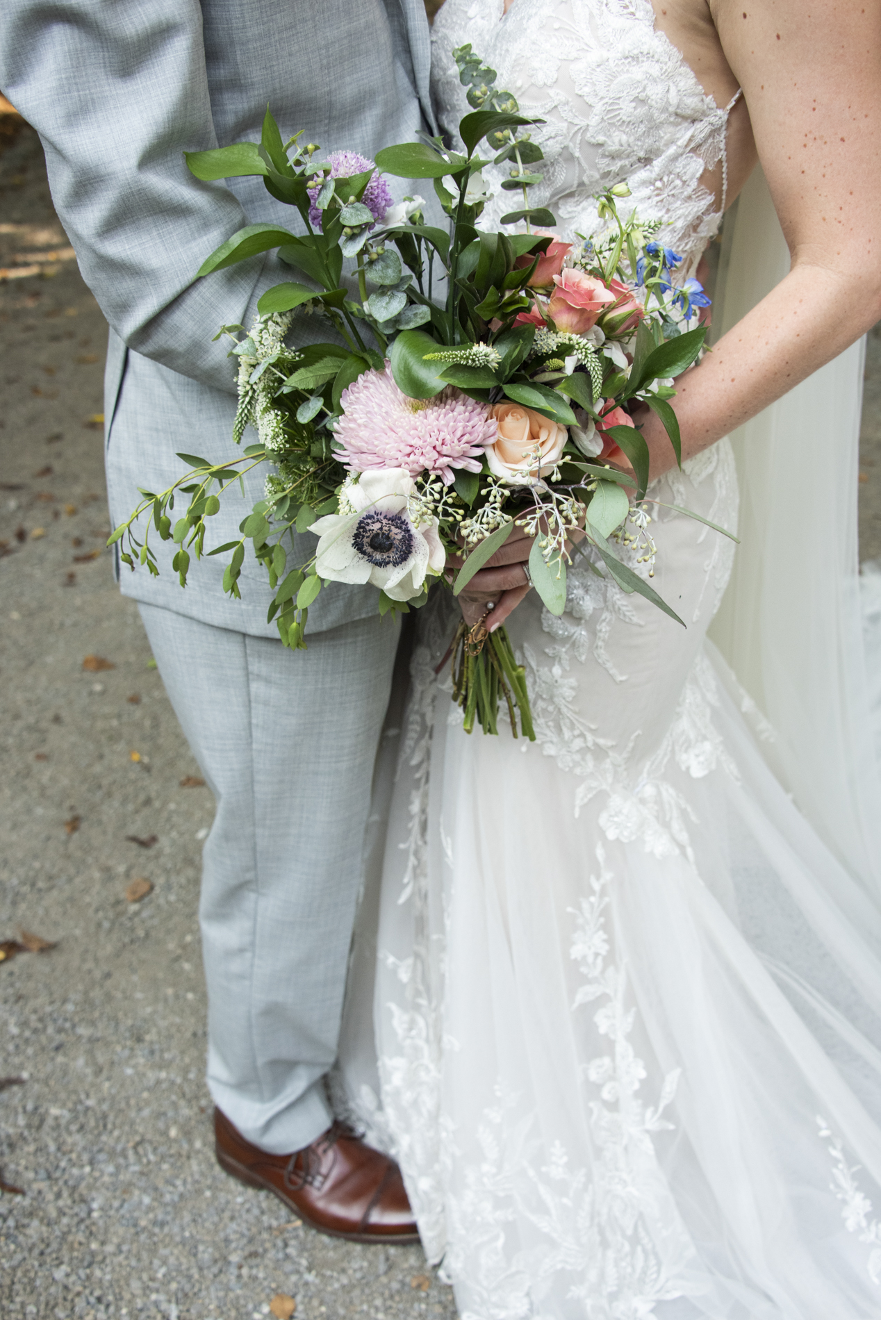 Couple holding wedding bouquet in Andrews, NC