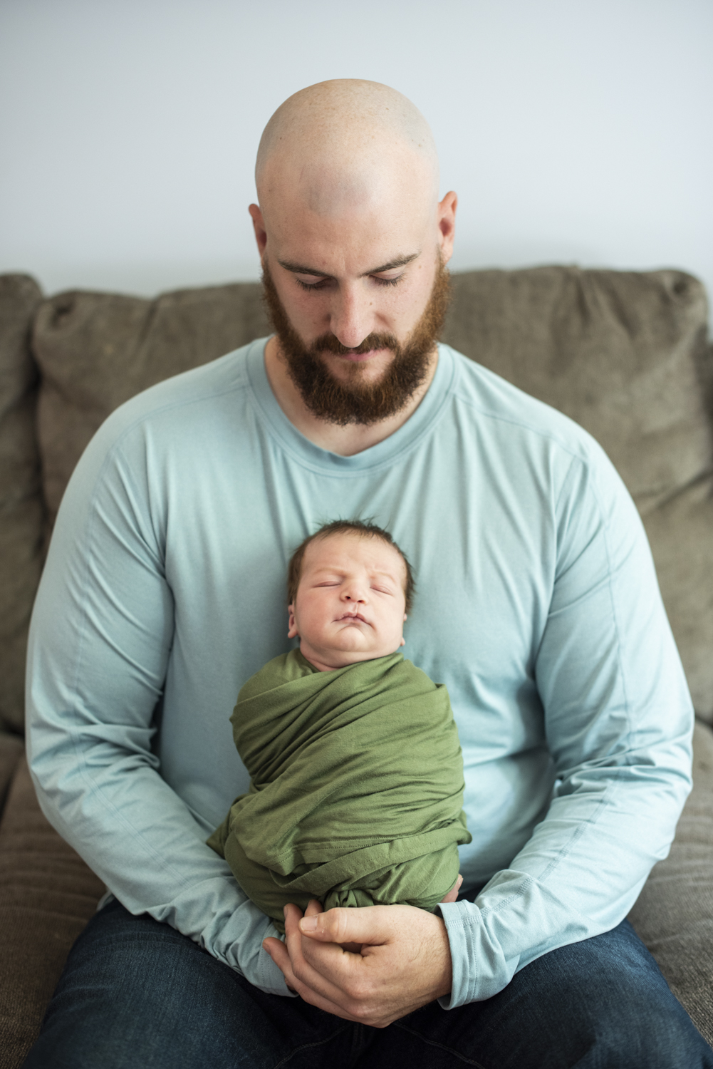 Dad holding baby during at Home Newborn Photography in Asheville