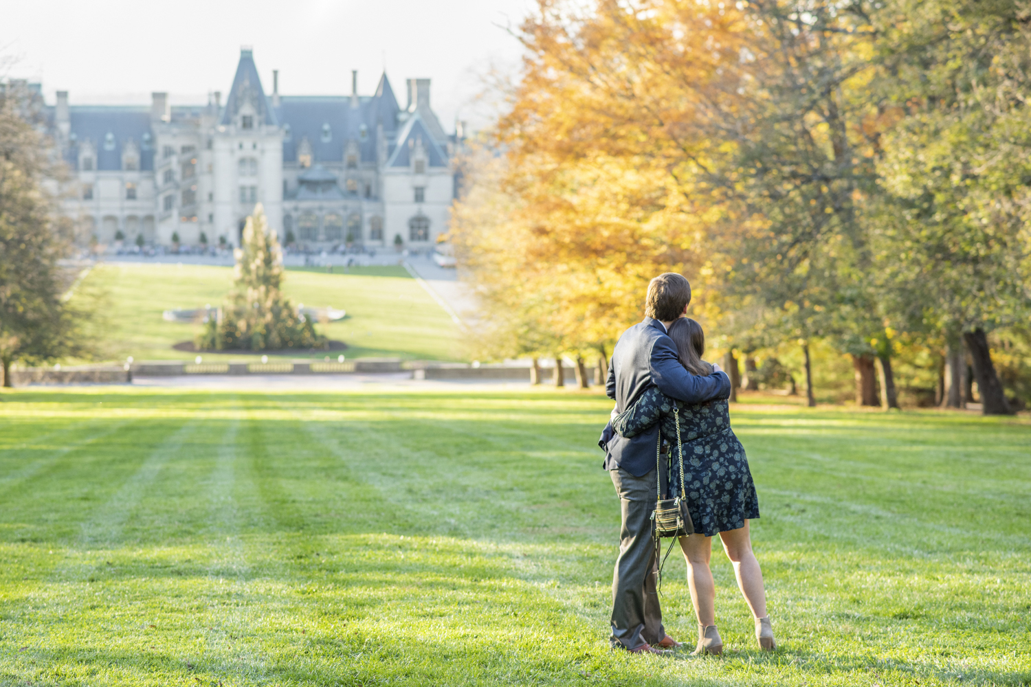 Couple hugging at Biltmore Estate fall engagement photography