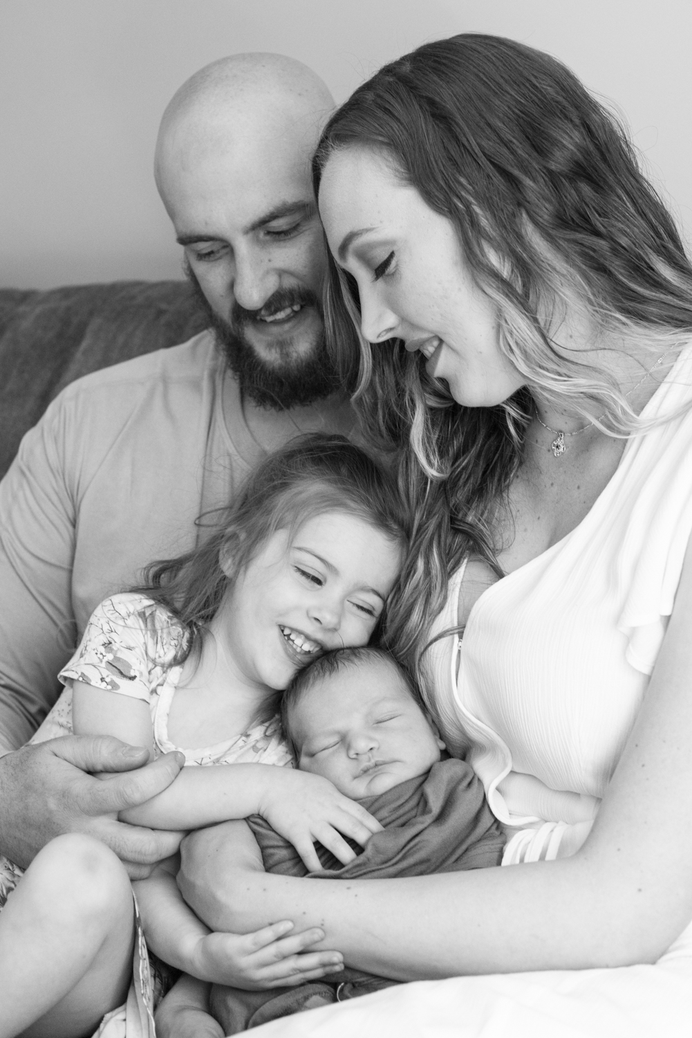 Family smiling at Home Newborn Photography in Asheville