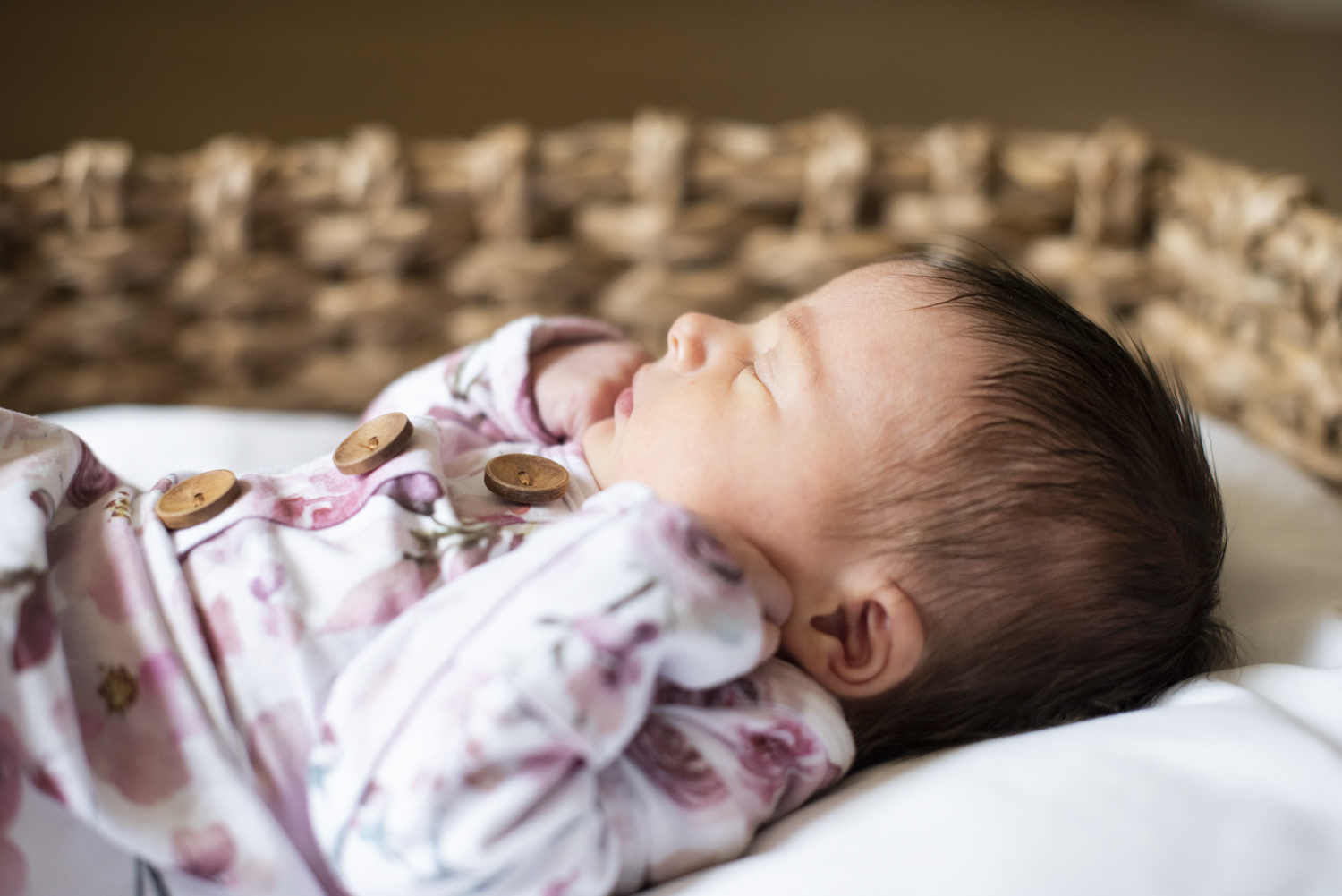 Newborn baby girl in basket