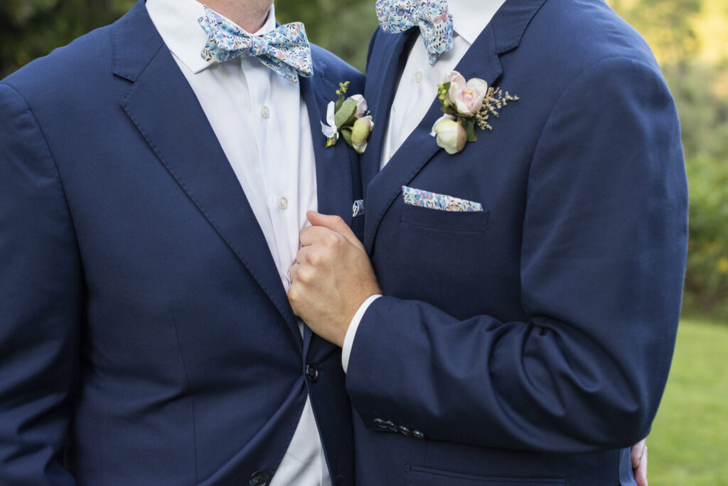 Groom holding lapel at wedding in Asheville, NC