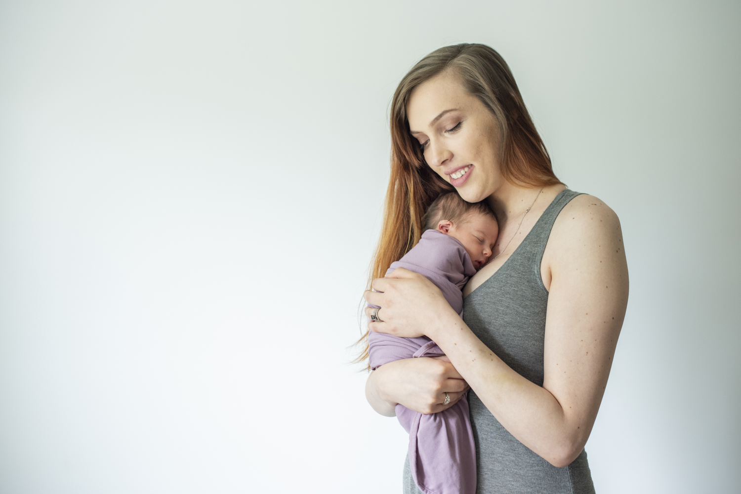 Mom holding baby girl