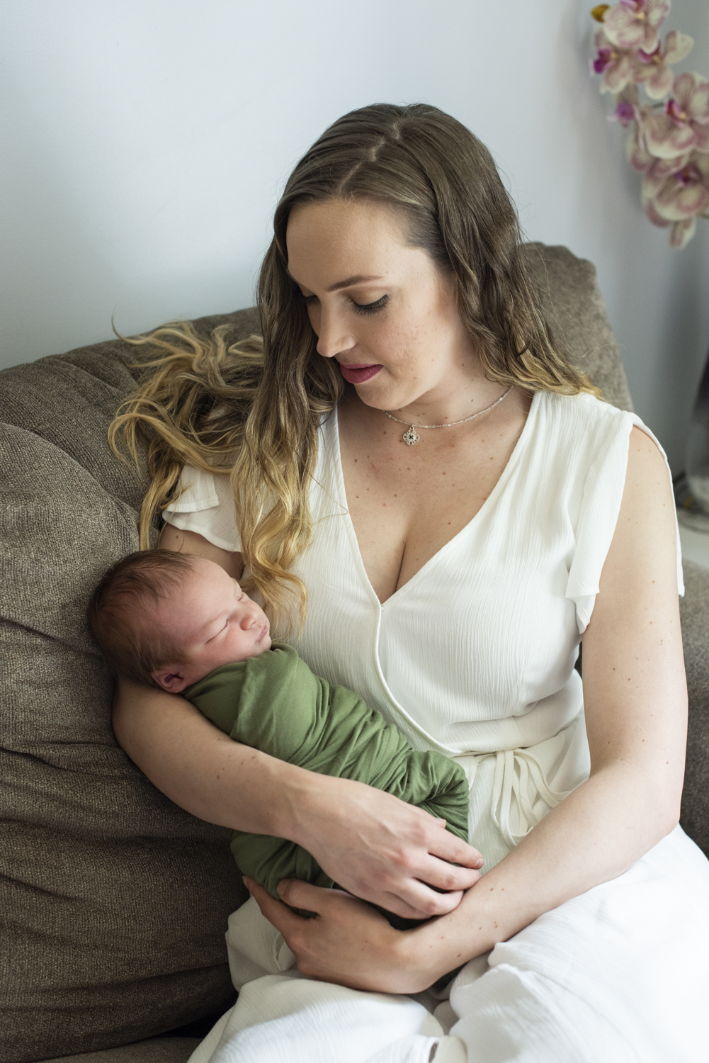 Mom holding baby during newborn photos in Asheville, NC