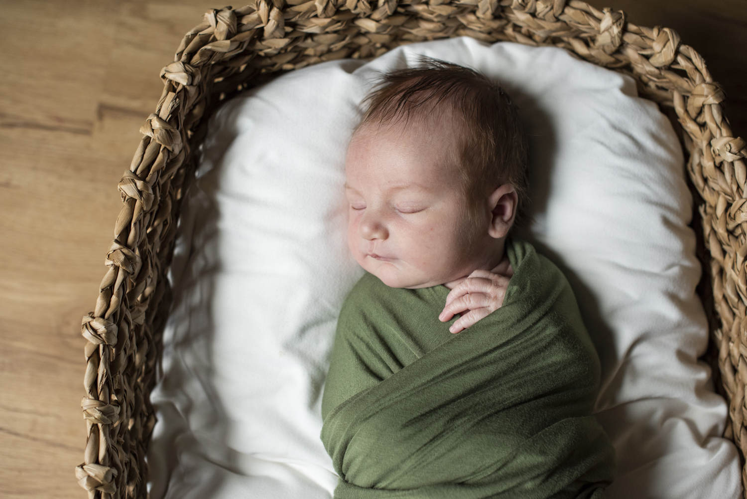 Newborn baby in basket At Home Newborn Photography in Asheville